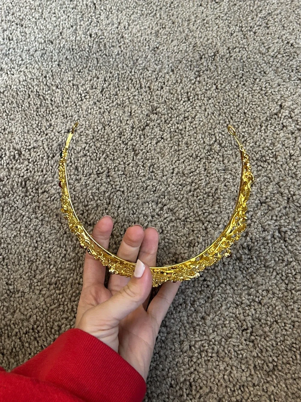 Gold colored crown headband with red and green faux gemstones
